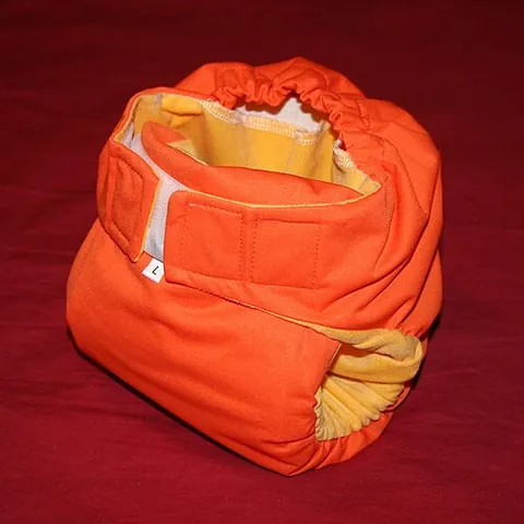 pocket diaper: a type of cloth diaper, secured with snaps or velcro, that consists of a waterproof inner and outer...