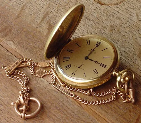 pocket watch: a watch carried in the pocket, often with a closing cover and usually attached to a chain