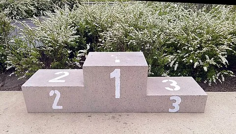 podium position: an outcome of being among the best three participants in a competition