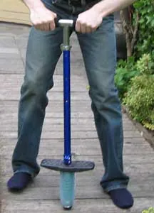 pogo stick: a toy, used for hopping up and down on, consisting of a pole with a T-bar handle at one end, and...