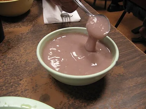 poi: the traditional staple food of Hawaii, made by baking and pounding the kalo (or taro) root, and...