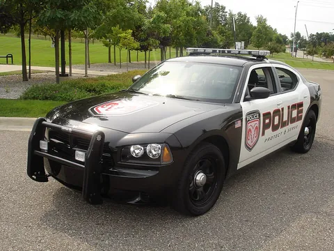 police car: an automobile used by a police officer when on duty. Usually marked with police livery; sometimes...