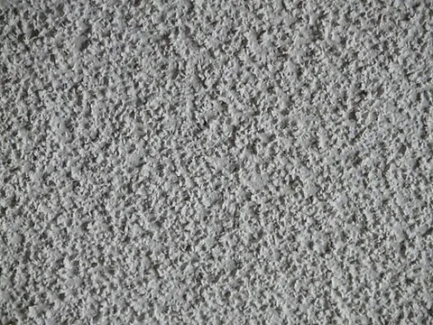 popcorn ceiling: a ceiling having a type of waterbased spray-on treatment characterized by a rough, lumpy texture