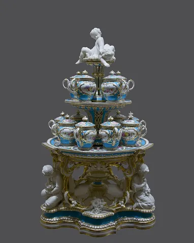 porcelain: a hard white translucent ceramic, originally made by firing kaolin, quartz, and feldspar at high...