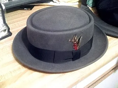 pork pie hat: a flat-topped, round, man's hat popular among musicians of jazz, blues, and ska, made famous by the...