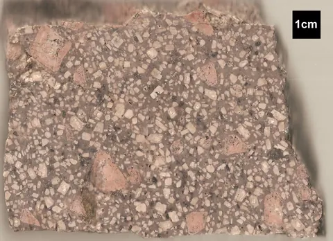 porphyry: a hard igneous rock consisting of large crystals in a fine-grained matrix