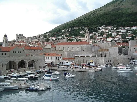 port: a place on the coast at which ships can shelter, or dock to load and unload cargo or passengers