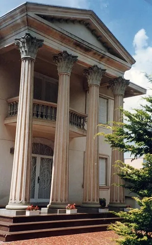 portico: a porch, or a small space with a roof supported by columns, serving as the entrance to a building
