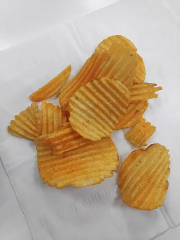 potato crisp: a thin slice of potato that has been deep-fried until it is brittle and crispy, and which is eaten...