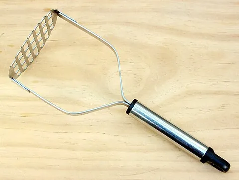 potato masher: a utensil used to mash potatoes