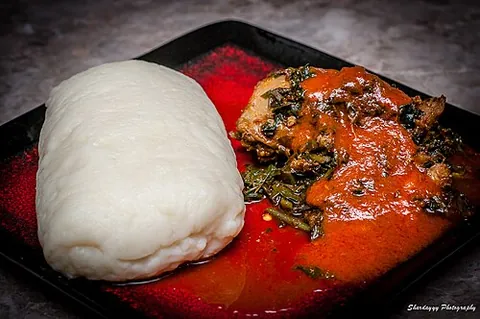pounded yam: a Nigerian swallow prepared by pounding yam with a mortar and pestle