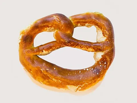 pretzel: a toasted bread or cracker usually in the shape of a loose knot