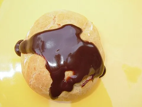 profiterole: a small, hollow case of choux pastry with a filling
