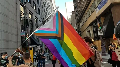 progress pride flag: a variant of the rainbow flag consisting of the original six horizontal bars with the addition of a...