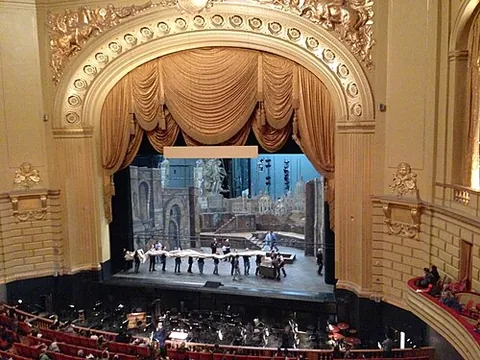 proscenium arch: the arch that frames a theater stage, and separates it from the auditorium