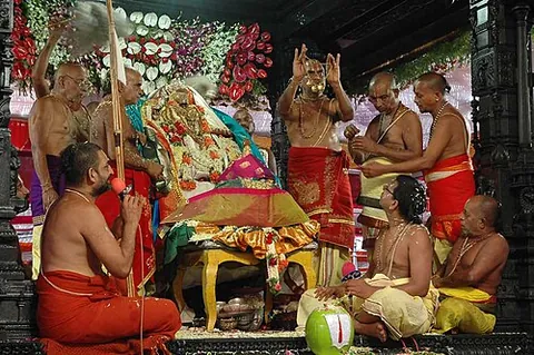 pujari: someone who performs a puja, especially a priest in a Hindu temple