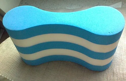 pull buoy: figure-eight shaped piece of closed-cell foam used in swim workouts