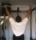 pull-up: an exercise done for strengthening the arms and back in which one lifts one's own weight while...