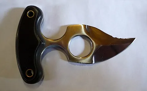 push dagger: a short bladed dagger with a handle (often T-shaped) designed to be grasped in the hand with the...