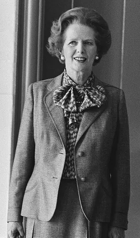pussy bow: a large, floppy bow on an item of clothing, often a blouse or shirt
