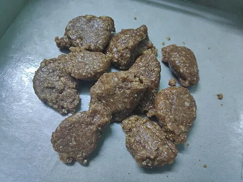pustakari: a Nepali form of candy made from molasses, cooked with ghee and milk and topped with coconut,...