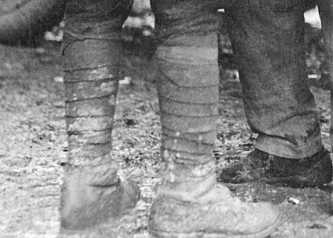 puttee: a strip of cloth wound round the leg, worn for protection or support by hikers, soldiers etc