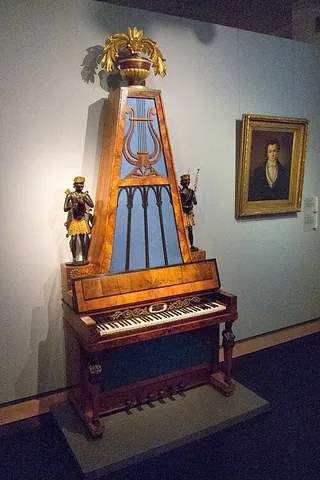 pyramid piano: a piano that has its strings slanting upward from left to right in a case that is shaped like a...