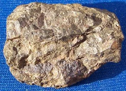 pyrrhotite: a weakly magnetic ferrous sulfide mineral, FeS