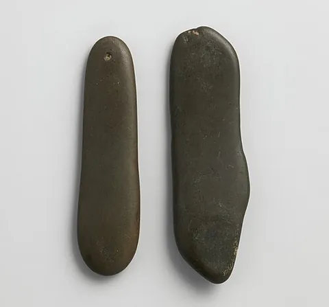 qairaq: a pair of flat oval stones used as clappers or castanets used in Tajik and Uzbek music