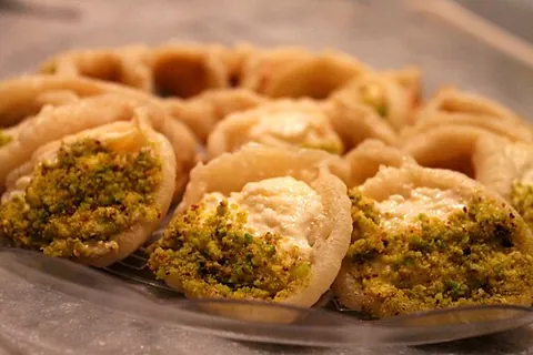 qatayef: sweet dumplings filled with cream or nuts, traditionally served in Arab communities during Ramadan