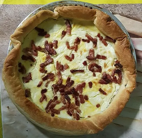 quiche lorraine: a type of quiche, originally from the area of Lorraine in France, made with cheese and bacon