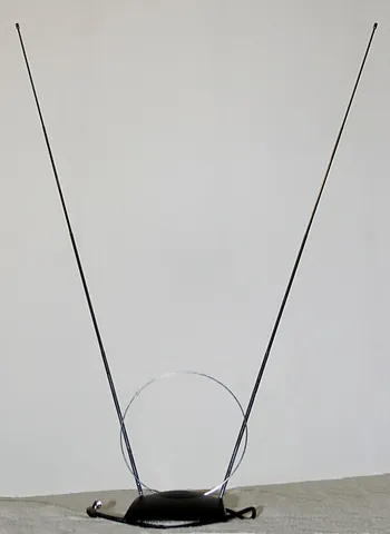rabbit ears: an indoor dipole antenna consisting of two usually extensible rods connected to a base to form a V...