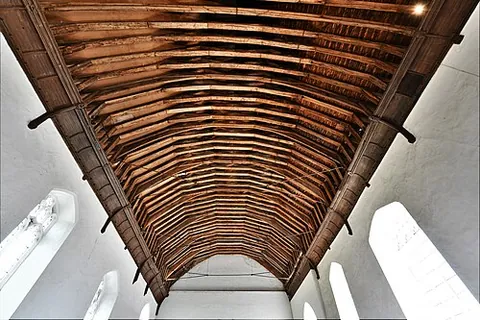 rafter: one of a series of sloped beams that extend from the ridge or hip to the downslope perimeter or...