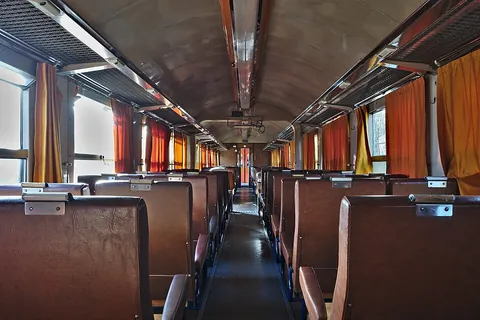 railroad car: any railway vehicle or rolling stock