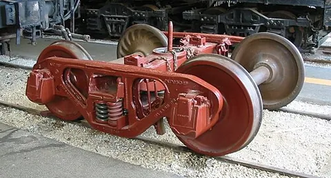 railroad truck: a chassis or framework-like structure underneath a railroad car to which wheel axles (and, hence,...