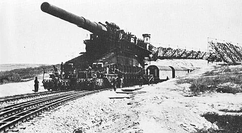 railway gun: a massive and heavy mobile artillery gun, built, transported by, and fired from a specially...