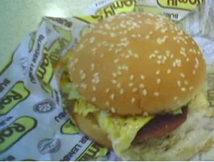 ramly burger: a kind of burger having the patty wrapped in an omelette and topped with several condiments