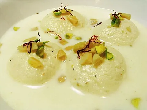 ras malai: a sweet dish found in the Indian subcontinent consisting of sugary cream-colored balls of dough and...