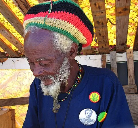 rastacap: a round, knit or crocheted cap associated with Rastafaris who have dreadlocks