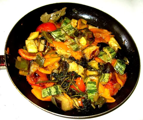ratatouille: a traditional French Provençal stewed vegetable dish consisting primarily of tomatoes, zucchini and...