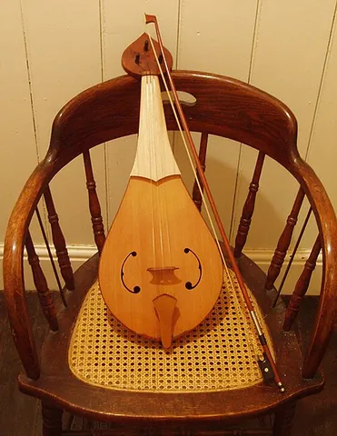 rebec: an early three-stringed instrument, somewhat like a simple violin only pear shaped, played with a...