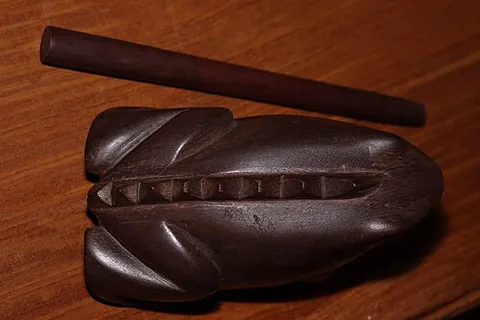 reco-reco: a scraped percussion instrument used in Brazilian music, traditionally having a sawtooth-notched...