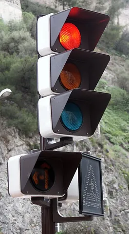 red light: a warning light, especially as a traffic signal indicating stop