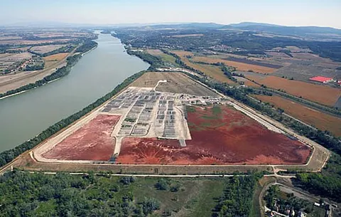 red mud: a mixture of solid and metallic oxide-bearing impurities that is a waste product of bauxite...