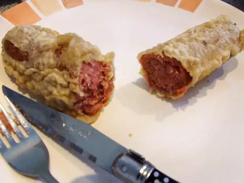 red pudding: a battered, deep-fried meat dish resembling a sausage