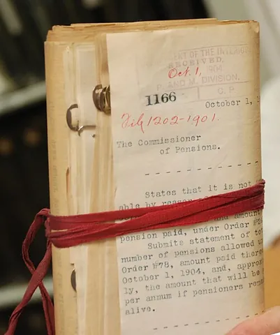 red tape: the binding tape once used for holding important documents together