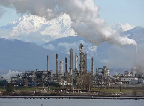 refinery: a building, or a mass of machinery, used to produce refined products such as sugar, oil, or metals