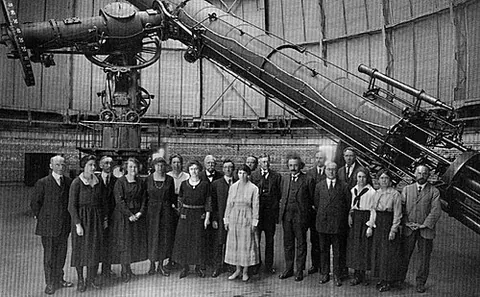 refracting telescope: a telescope which produces a magnified image by refracting light through a series of lenses housed...