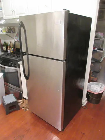 refrigerator: a household or commercial appliance used for keeping food fresh using refrigeration