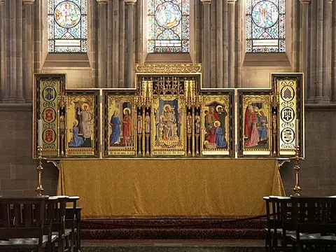reredos: a screen or decoration behind the altar in a church, usually depicting religious iconography or...